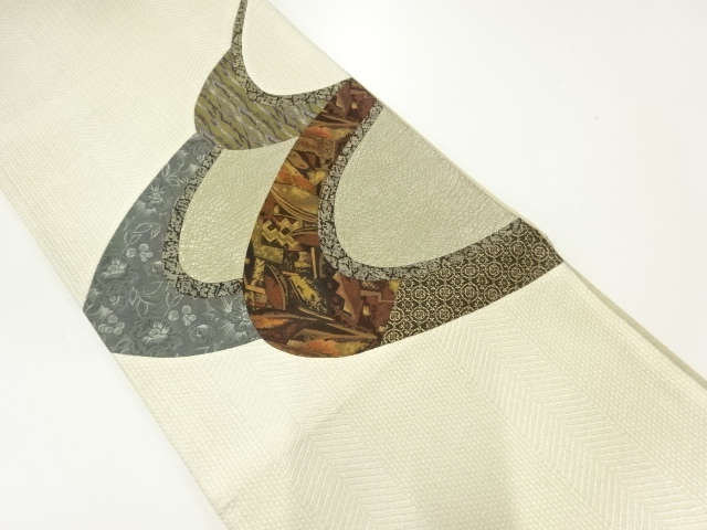 切り嵌め草花に抽象模様織出し袋帯